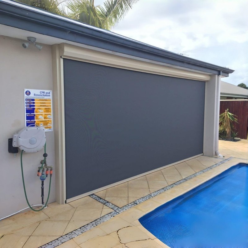 Surface-mounted patio screen beside a swimming pool.