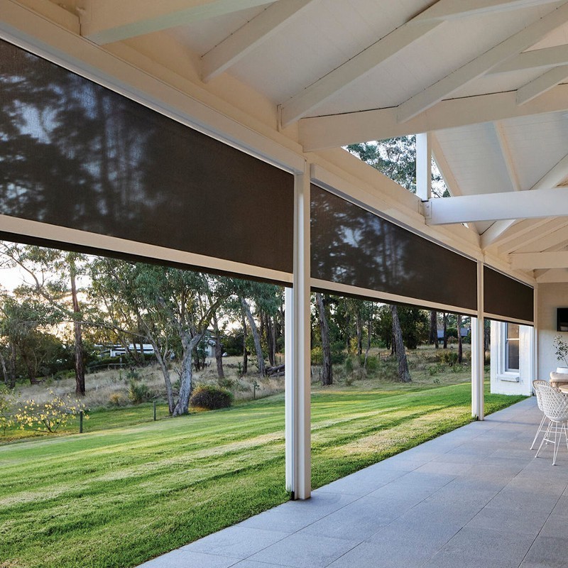 Three patio screens partially lowered between white columns.