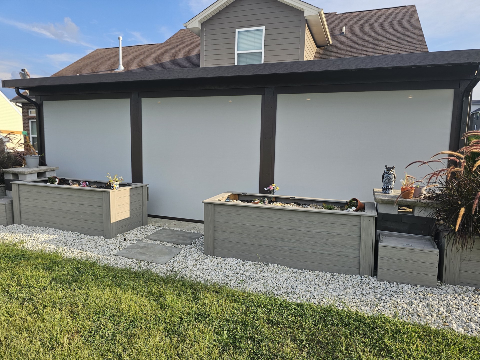 Three custom patio screens installed on a covered porch.